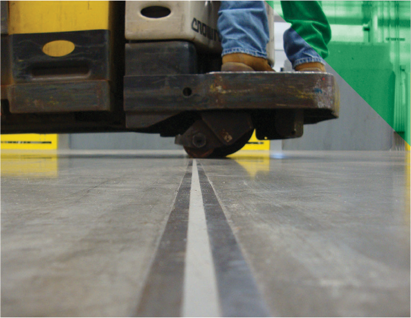 Feet of worker on forklift Square